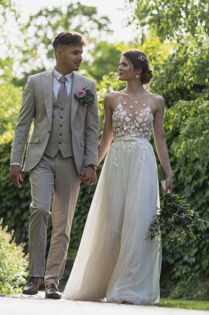 petevelvet_wedding_231 Loving embrace in green garden London wedding photographer