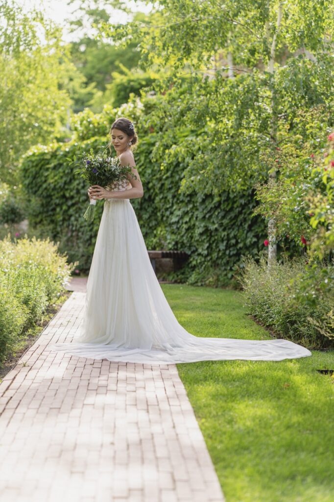 petevelvet_wedding_241 Bride twirling in garden London wedding photographer