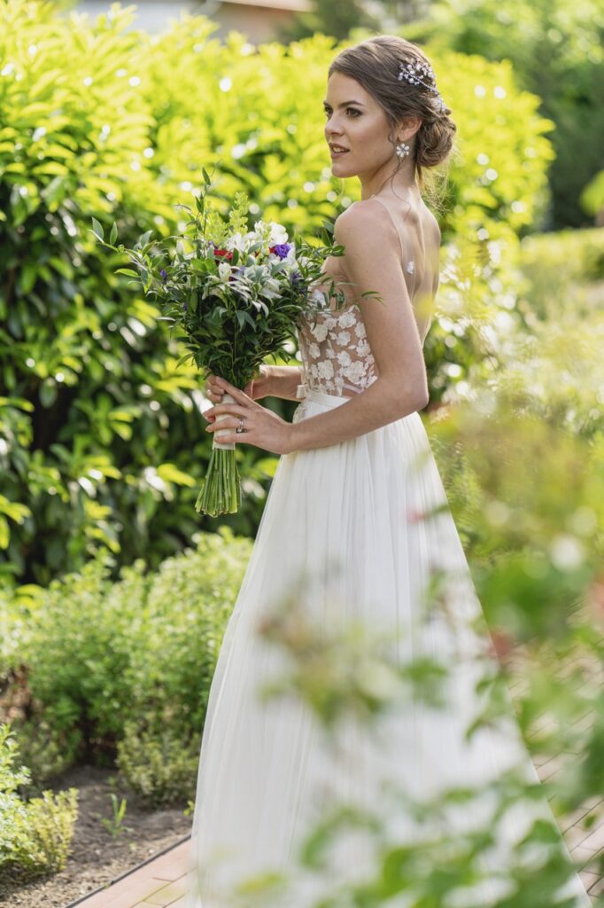 petevelvet_wedding_242 Couple holding hands in garden London wedding photographer