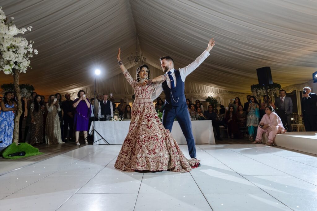 petevelvet_wedding_343 Groom lifting modern Indian bride London wedding photographer